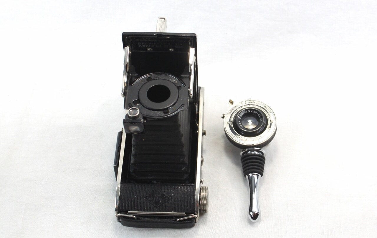 Vintage PB20 Plenax Agfa Folding Camera Lens Wine and Champagne Bottle Stopper with Art Deco Display Stand