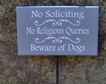 No Soliciting No Religious Queries Beware Of Dogs Sign on a Stake