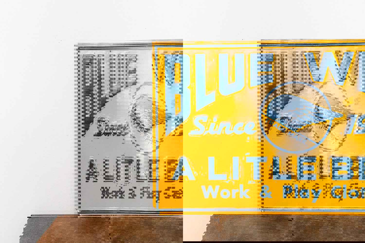 Vintage Blue Wing Clothing Tin Sign - Timeless Style Wall Decor
