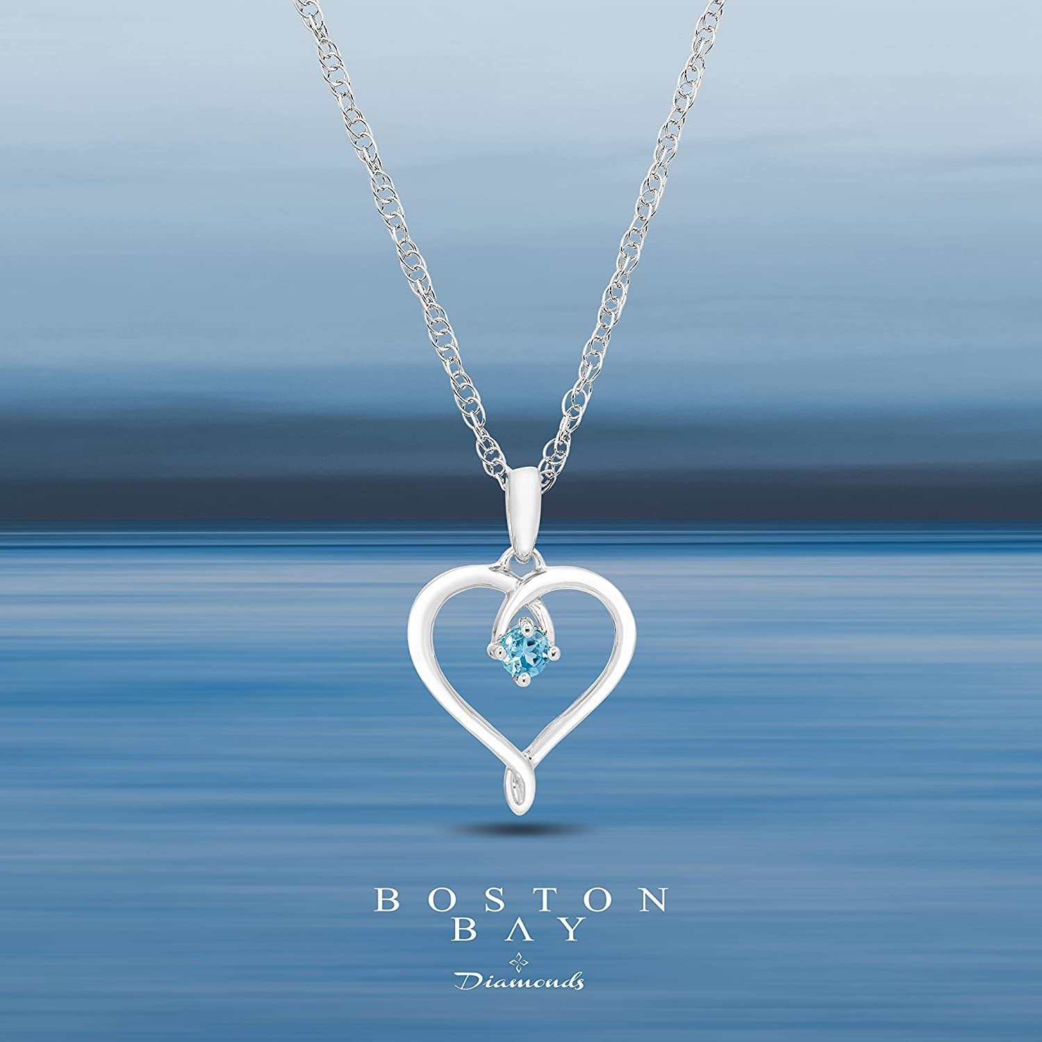 Genuine Blue Topaz Heart Pendant in Sterling Silver