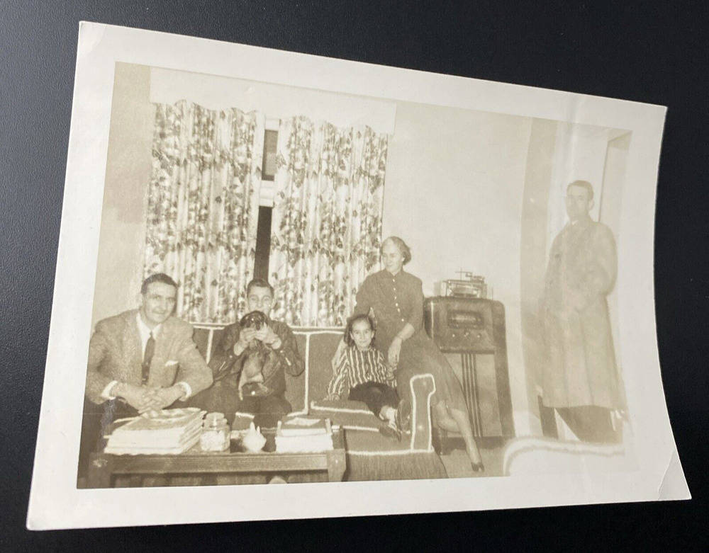 Vintage 1950s Family Living Room Scene with Man, Dog, and Radio