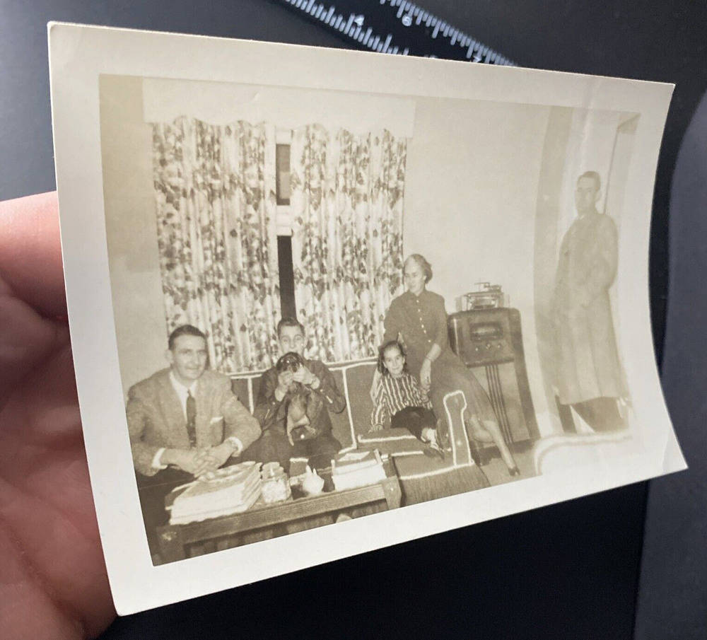 Vintage 1950s Family Living Room Scene with Man, Dog, and Radio