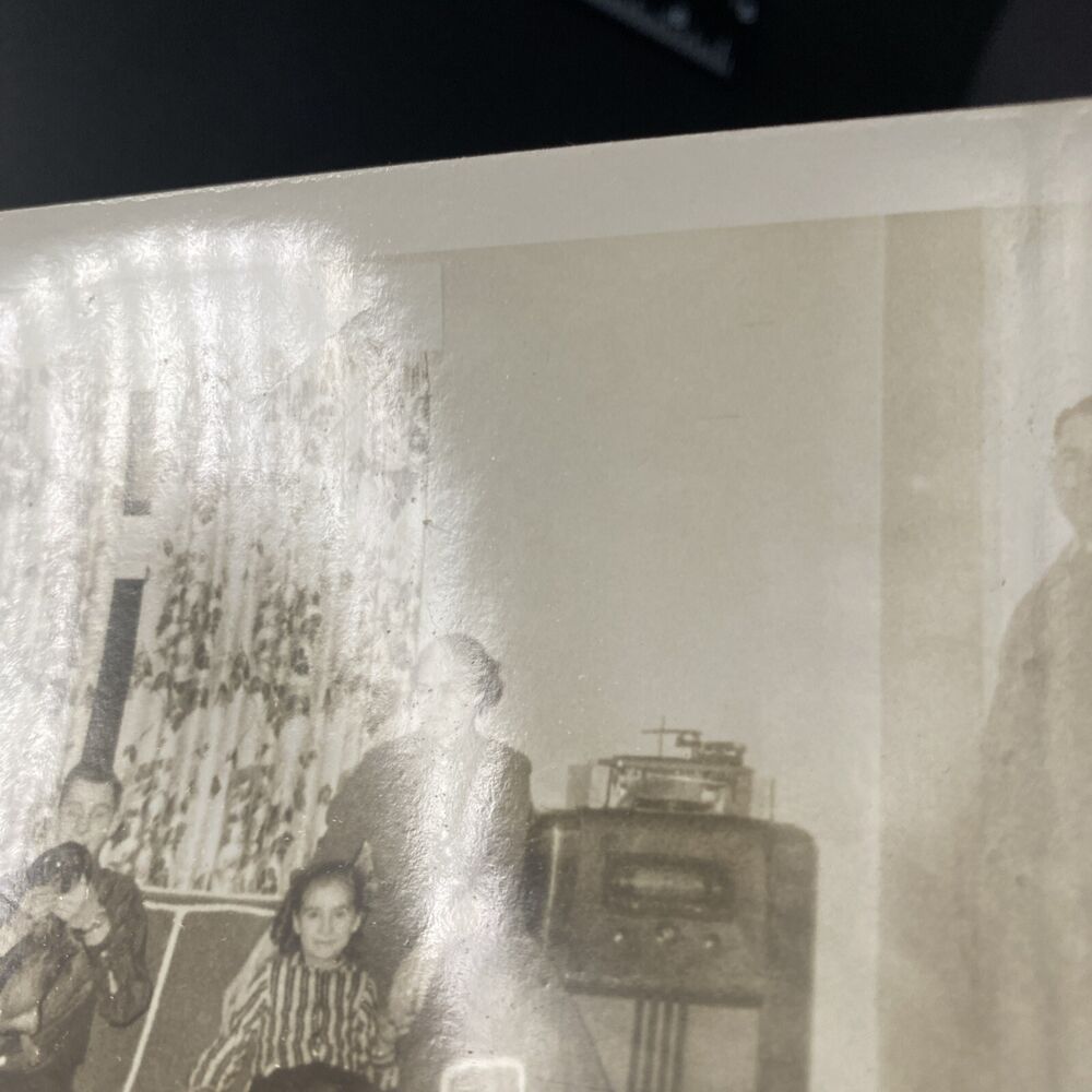 Vintage 1950s Family Living Room Scene with Man, Dog, and Radio
