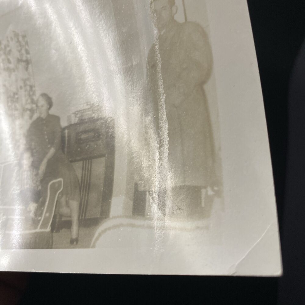Vintage 1950s Family Living Room Scene with Man, Dog, and Radio