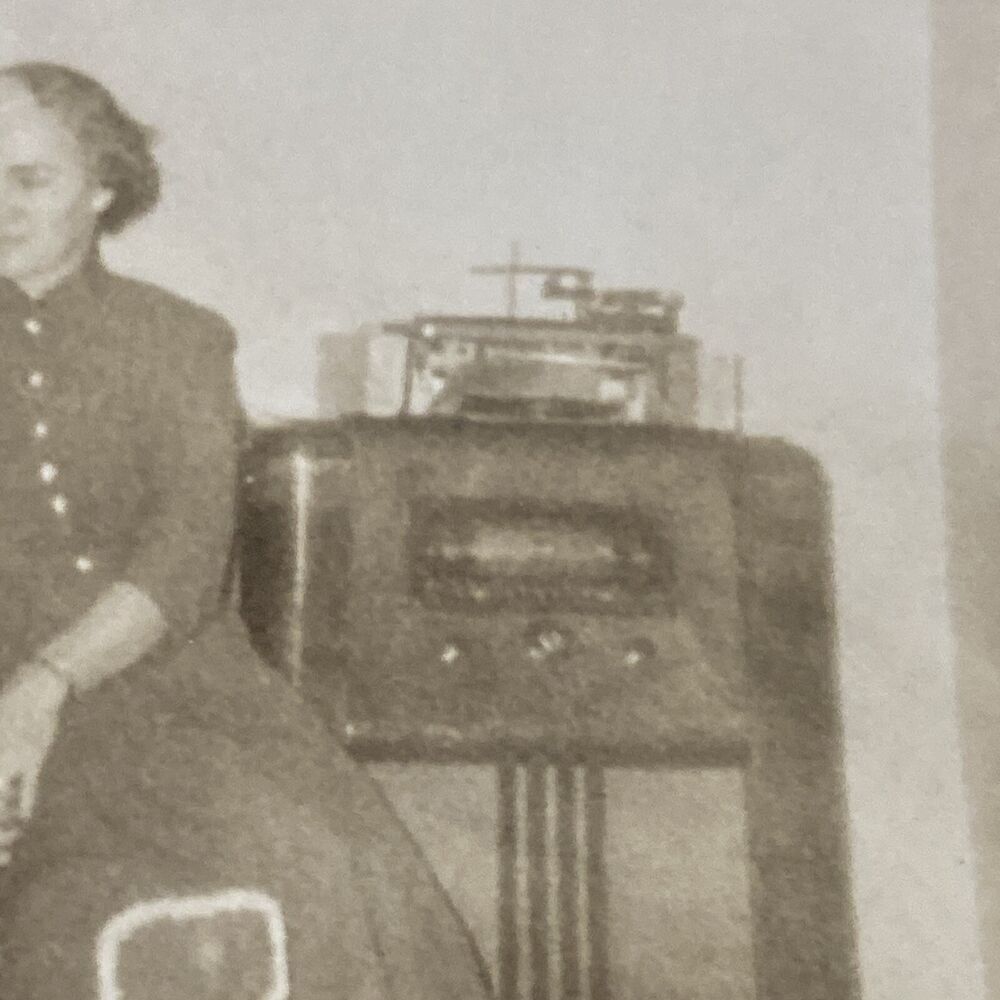 Vintage 1950s Family Living Room Scene with Man, Dog, and Radio