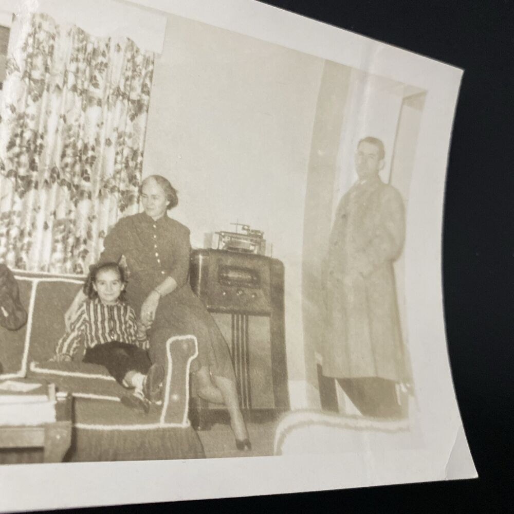 Vintage 1950s Family Living Room Scene with Man, Dog, and Radio